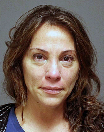 Woman charged with threatening husband with knife