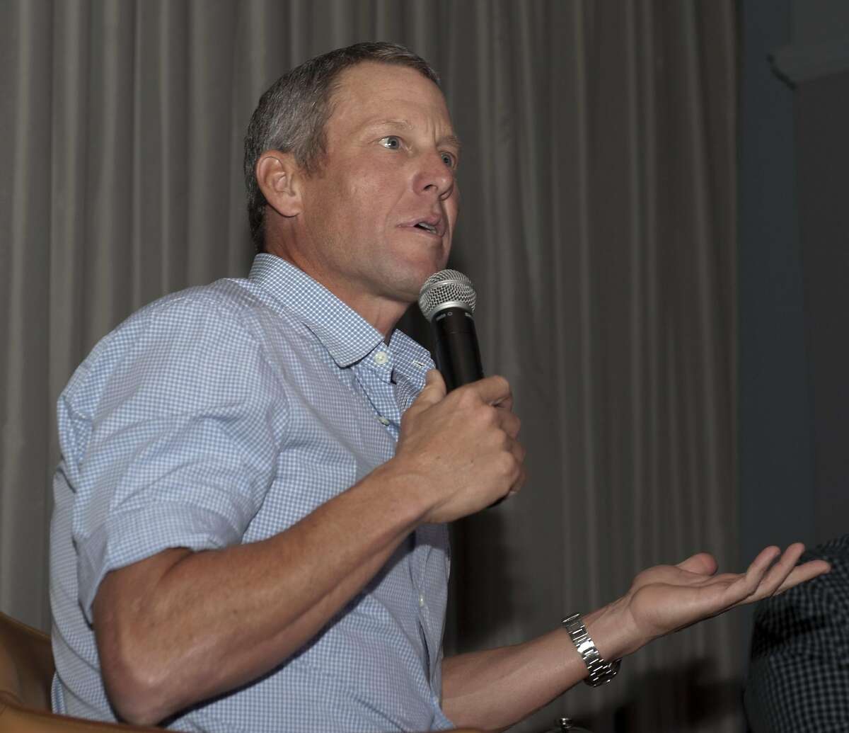 Lance Armstrong speaks to the crowd during an interview conducted at The Batttery, a private club in San Francisco, on March 11, 2016.