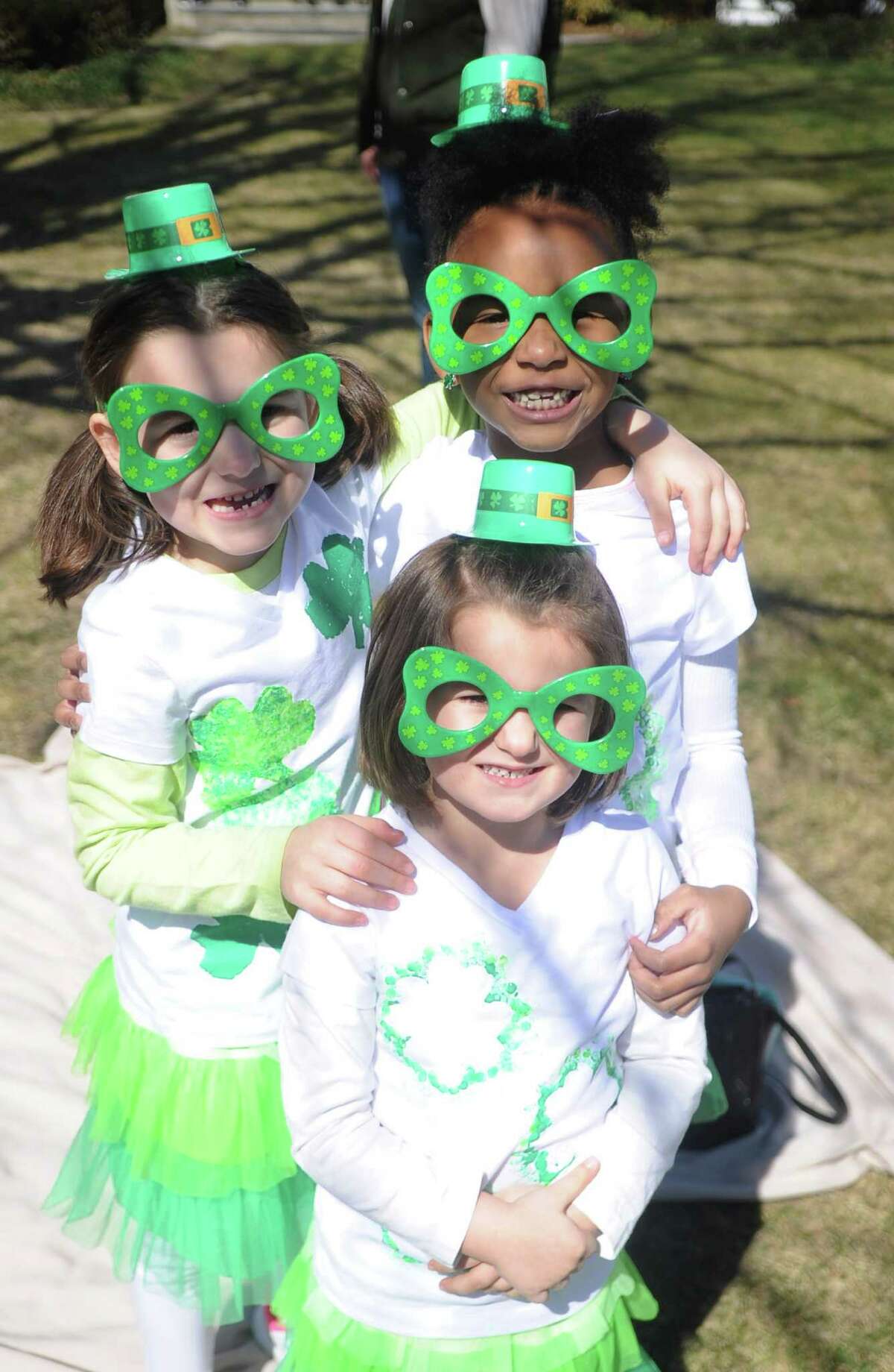 Clockwise from top left, Dakota DiNuzzo, 6, Marley Clarke, 6, and Hailey DiNuzzo, 3, at the St. Patrick's Day Parade in Milford, Conn., on Saturday, March 12, 2016.