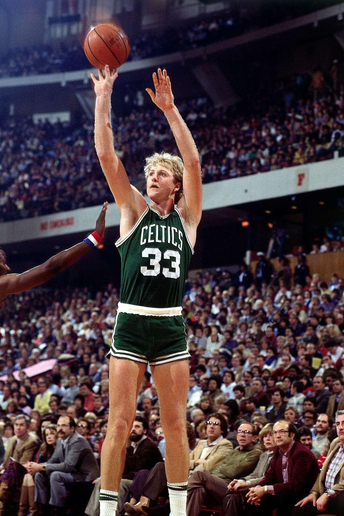 1982: Larry Bird #33 of the Boston Celtics takes a jumpshot during an NBA game. NOTE TO USER: User expressly acknowledges and agrees that, by downloading and or using this photograph, User is consenting to the terms and conditions of the Getty Images License Agreement. (Photo by Jerry Wachter/ NBAE/ Getty Images)