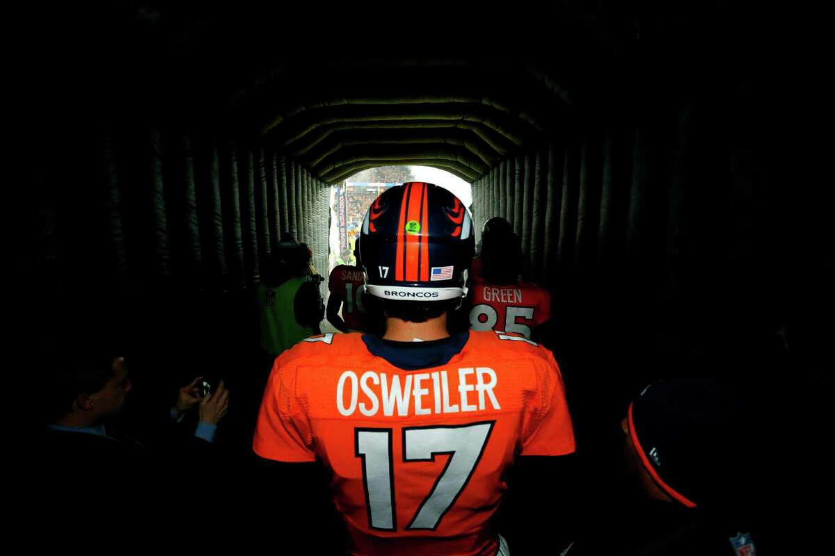 Denver Broncos quarterback Brock Osweiler (17) stands in the tunnel prior to an NFL football game against the New England Patriots, Sunday, Nov. 29, 2015, in Denver. (AP Photo/Jack Dempsey)