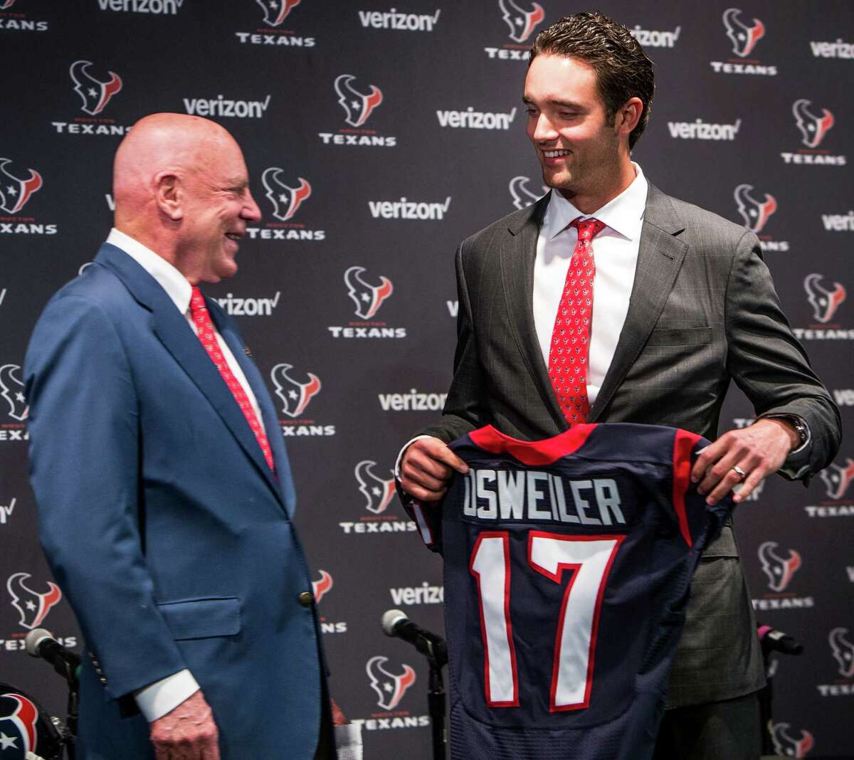 Quarterback Brock Osweiler is welcomed to Houston by Texans owner Bob McNair on Thursday.
