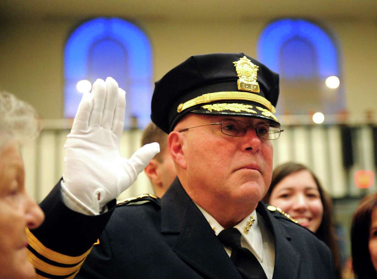 Armando Perez, the new acting Chief of Police for Bridgeport Police Department, takes the oath of office administered by Mayor Joe Ganim at a Swearing-in Ceremony at City Hall Common Council Chambers in Bridgeport, Conn., on Thursday Mar. 3, 2016.