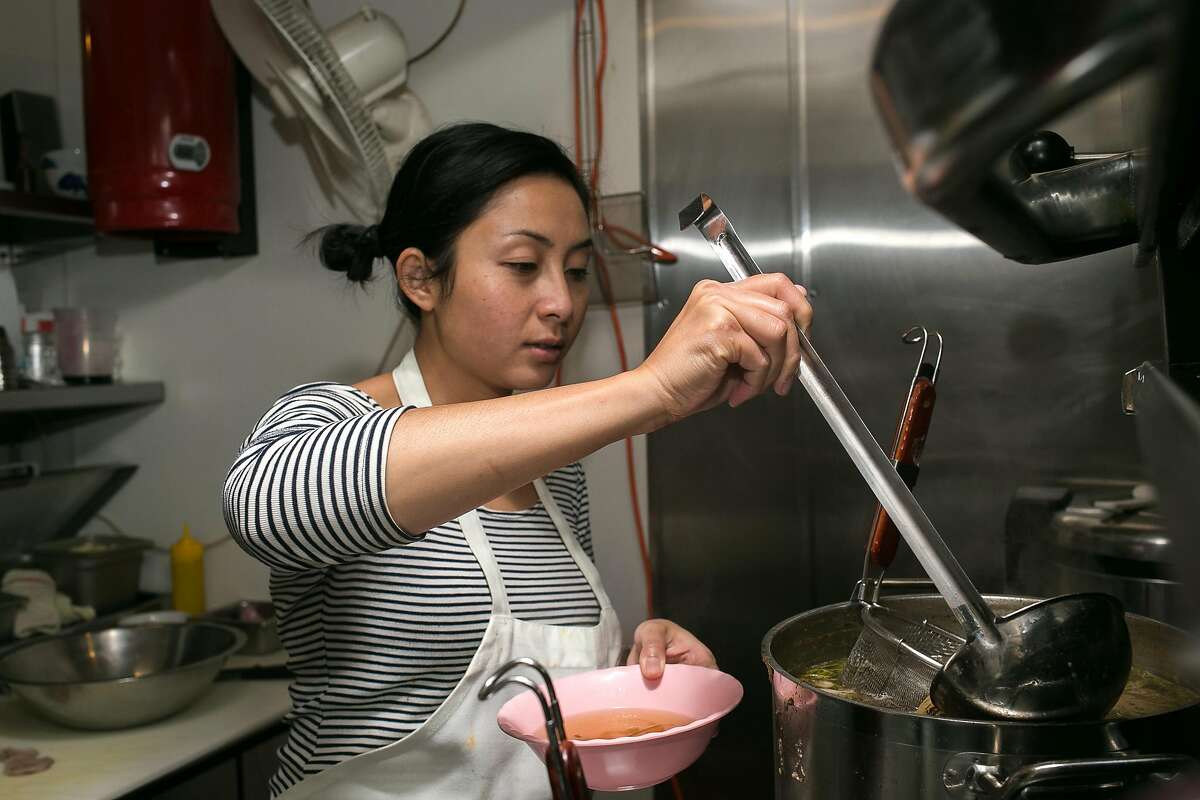 Nite Yun scoops broth into a bowl for the Kuy Tio Phnom Penh at Nyum Bai Cambodian pop-up hosted at Gashead Tavern in S.F.
