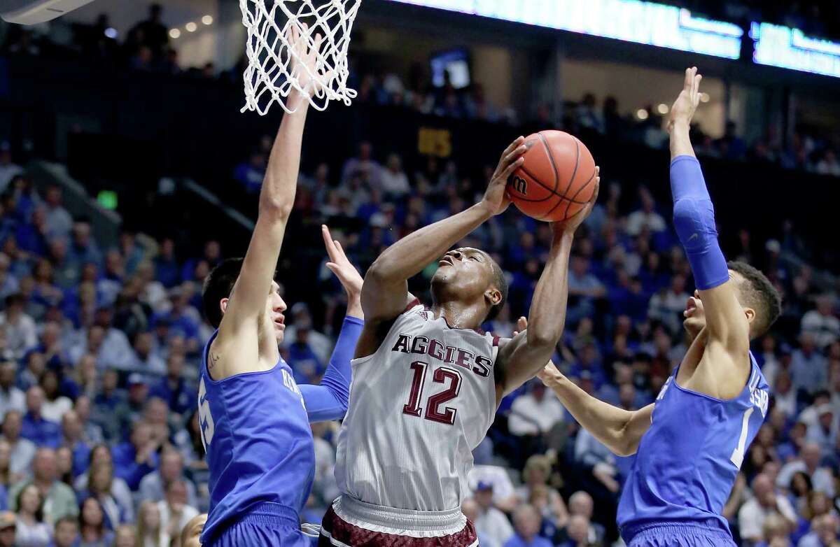 NASHVILLE, TN - MARCH 13: Jalen Jones #12 of the Texas A&M Aggies shoots the ball against the Kentucky Wildcats during the Championship Game of the SEC Basketball Tournament at Bridgestone Arena on March 13, 2016 in Nashville, Tennessee.