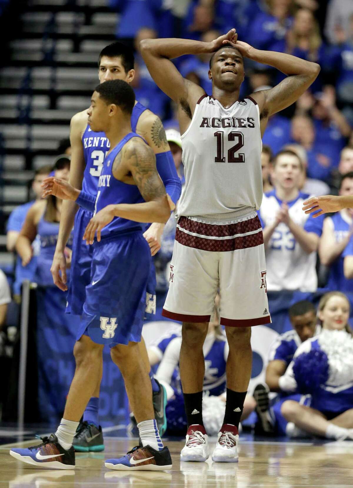 Texas A&M's Jalen Jones (12) reacts to being called for a foul against Kentucky during the second half of an NCAA college basketball game in the championship of the Southeastern Conference tournament in Nashville, Tenn., Sunday, March 13, 2016.