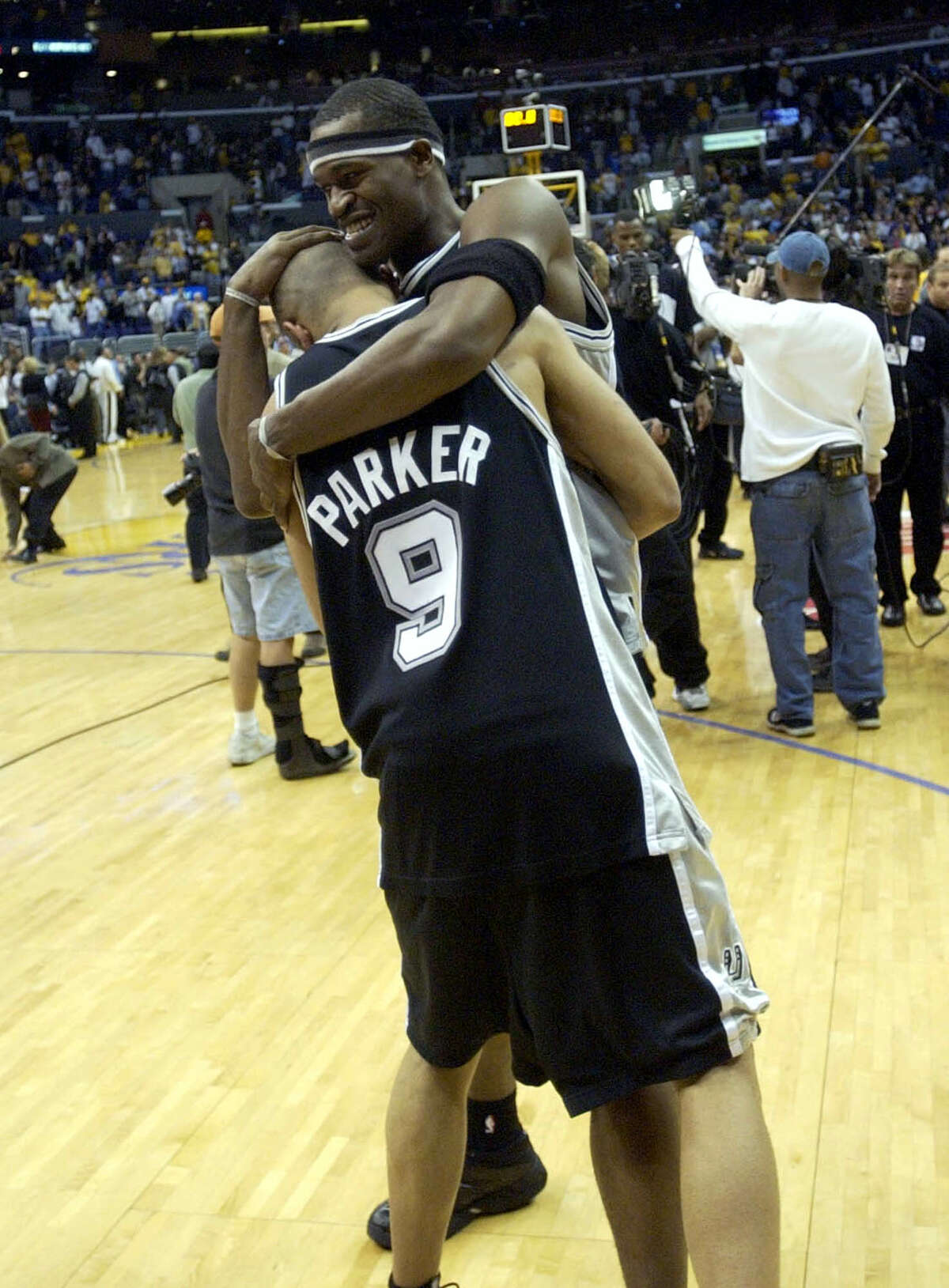 The Spurs’ Tony Parker and Stephen Jackson celebrate May 15, 2003 at the Staples Center in Los Angeles after winning Game 6 of the Western Conference semifinals game against the Lakers 110-82.