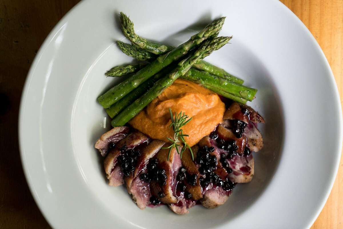 The pan seared duck is served at the Mustard Seed in Davis, Calif. on Friday, March 11, 2016. Davis offers activities for cyclists, diners and nature enthusiasts.