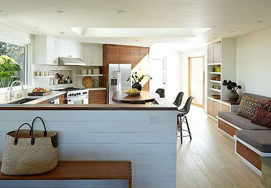 the redesigned kitchens bigger footprint makes room for a seating area and extra storage photo - The Kitchen Redesign the redesigned kitchens bigger footprint makes room for a seating area and extra storage photo - The Kitchen Redesign