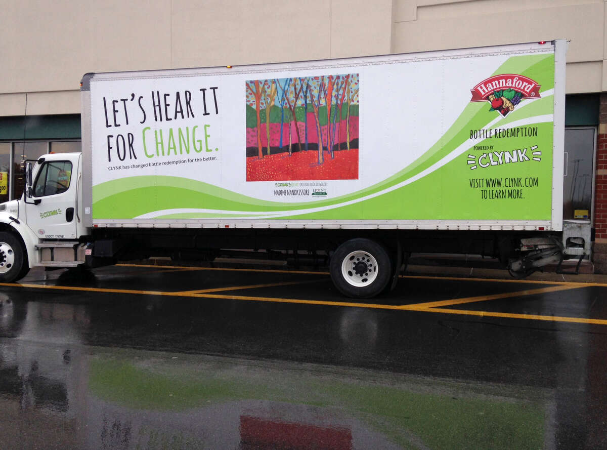 A Hanford CLYNK recycling truck is parked during a kickoff of the supermarket?’s new recycling program on Monday, March 14, 2016, in Colonie, N.Y. Hannaford customers can go to a store with a bag of recyclables, scanning a tag that identifies their personal account or a charity they designate, and then dropping the bag through a door into a room where Hannaford employees scan them. The first 10 bags are free. After that, it's $1.75. Charities receive 100 bags. The program was launched Monday at the Latham store but will expand to others. (Tim O?’Brien/Times Union)
