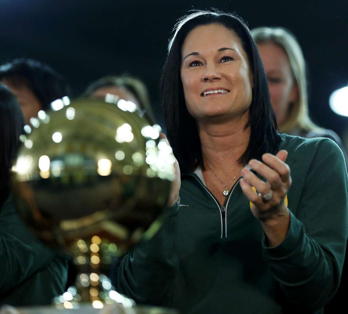 USF Women's Basketball head coach Jennifer Azzi claps after learning t...