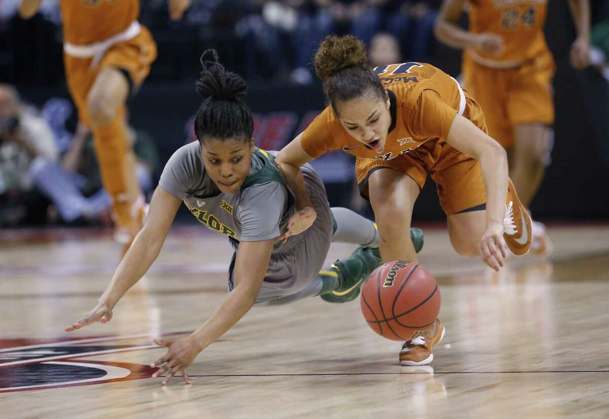 Baylor guard Niya Johnson, left, and Texas guard Brooke McCarty, right, chase a loose ball in the third quarter of an NCAA college basketball championship game in the Big 12 women’s tournament in Oklahoma City, Monday, March 7, 2016.