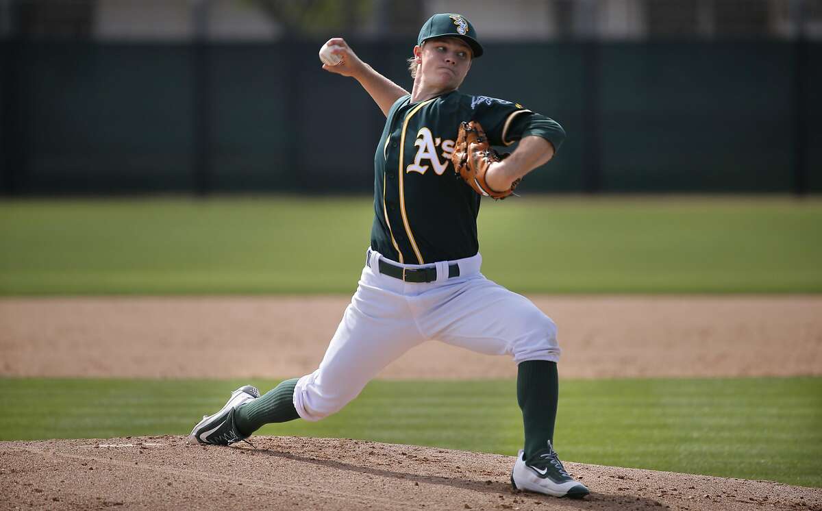 Sonny Gray 54 throws during the Oakland Athletics spring training workouts on Monday February 29, 2016, in Mesa, Arizona.