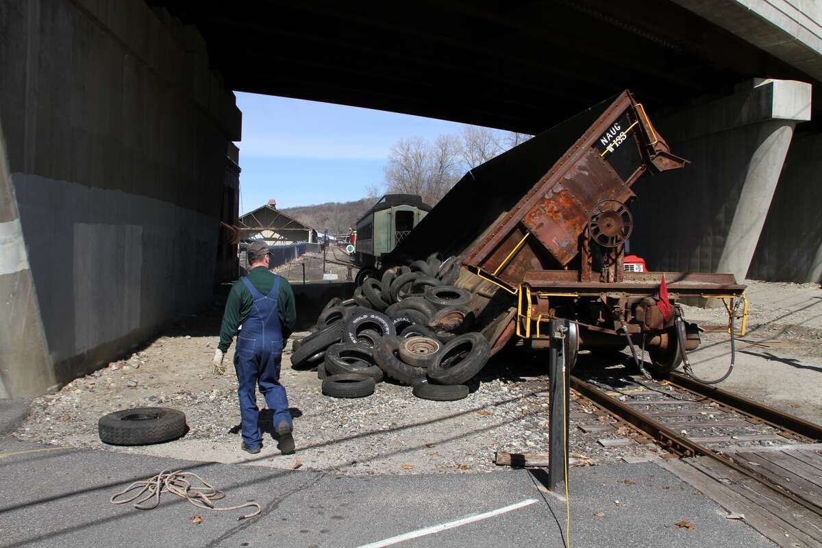 Bob Eberheim, a volunteer and board member with the RMNE, supervises the dumping of tires removed from the Frost Bridge area in Thomaston and Watertown before they were to be recycled.