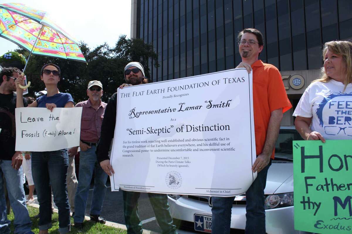 Protestors brought a “Flat Earth” Award to the San Antonio office of U.S. Rep. Lamar Smith on Tuesday to call attention to his efforts to discredit climate change science but he was not there.