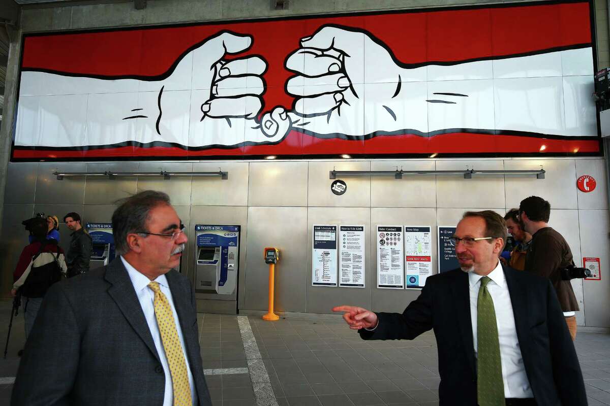 CEO of Sound Transit Peter Rogoff, right, and Ahmad Fazel, executive director of design and construction for Sound Transit, talk inside the new Capitol Hill light rail station during a Sound Transit-hosted first-look ride for the media from the University of Washington station to the Capitol Hill station, Tuesday, March 15, 2016. Both stations will begin train service Saturday at 10 a.m.