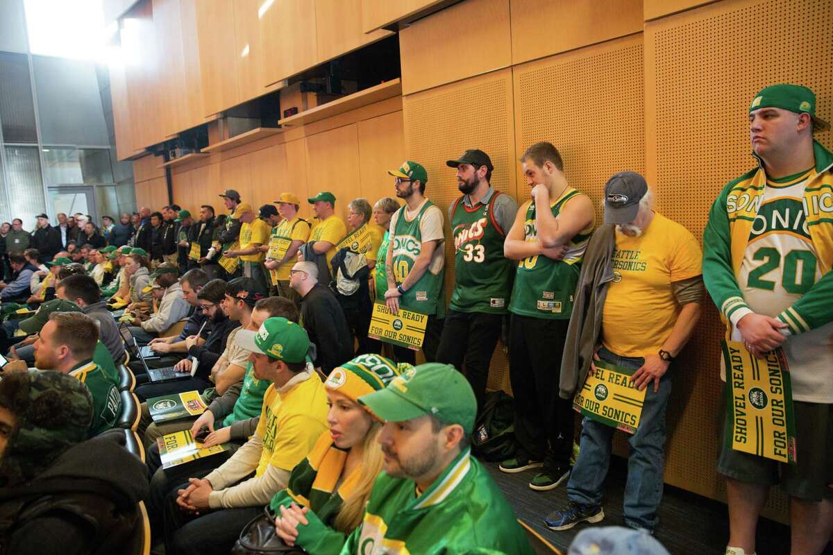 Numerous SuperSonic fans find standing-room-only in the city council chambers to show their support for a new Seattle SuperSonics arena in SoDo, at Seattle City Hall on Tuesday, Mar. 15, 2016.