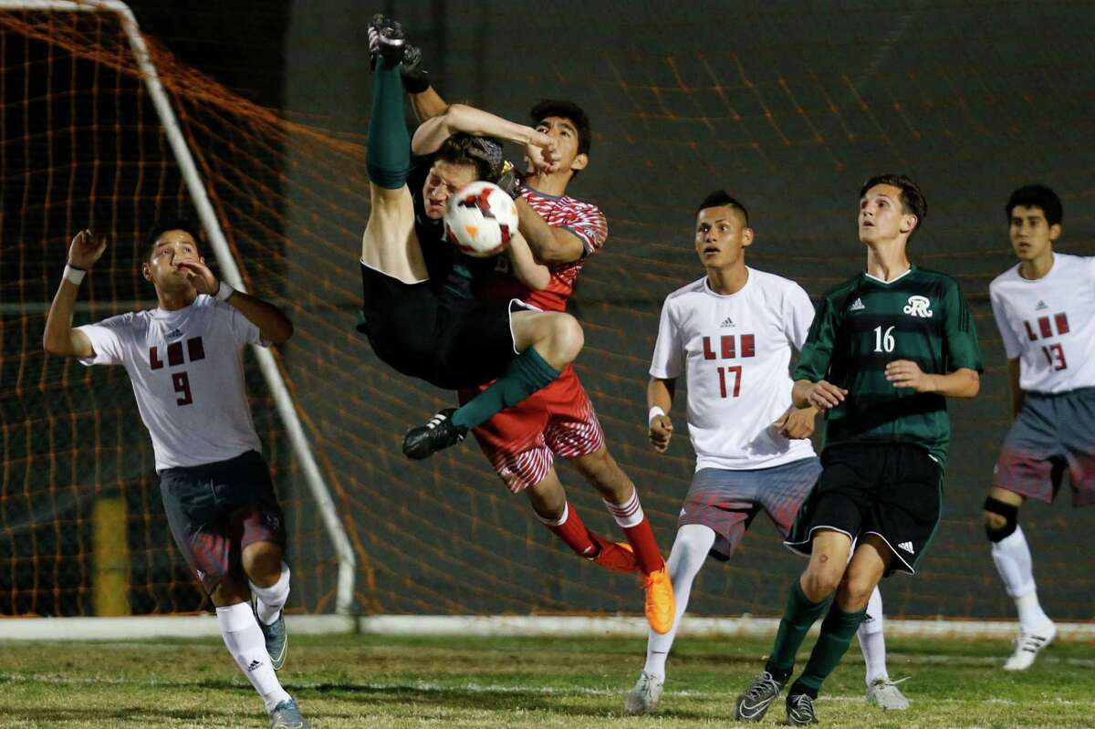Reagan’s Chaise Thiel tries to score on Lee goalie Victor Rodriguez on Feb. 19, 2016 at the Blossom Athletic fields.