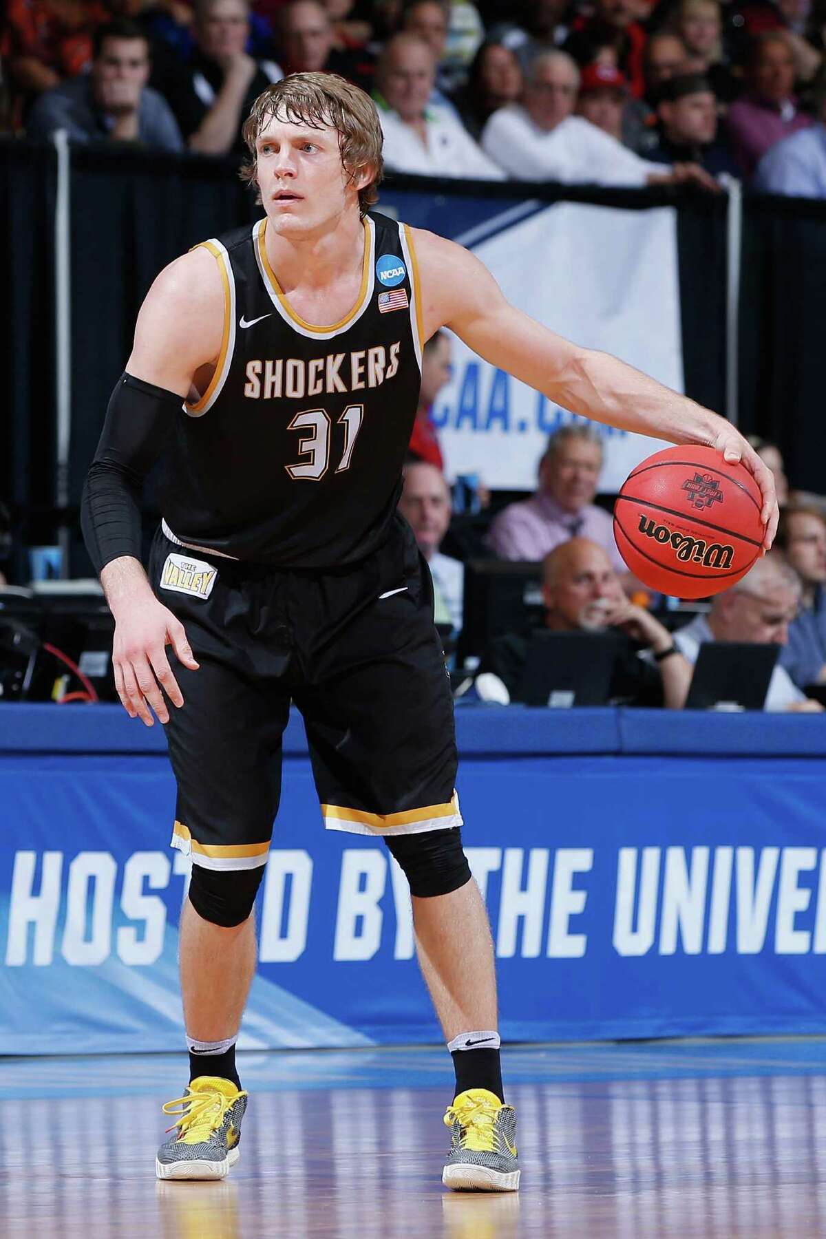 DAYTON, OH - MARCH 15: Ron Baker #31 of the Wichita State Shockers handles the ball in the first half against the Vanderbilt Commodores during the first round of the 2016 NCAA Men's Basketball Tournament at UD Arena on March 15, 2016 in Dayton, Ohio.