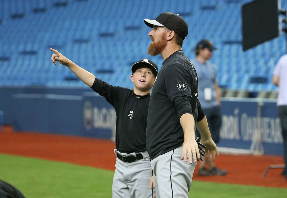 TORONTO, CANADA - MAY 25: Drake the son of Adam LaRoche #25 of the Chicago White Sox points to the roof as it opens during batting practice before the start of MLB game action against the Toronto Blue Jays on May 25, 2015 at Rogers Centre in Toronto, Ontario, Canada.
