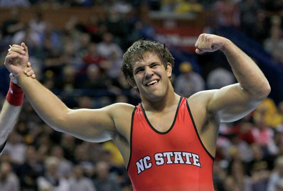 North Carolina State's Nick Gwiazdowski celebrates after defeating Michigan's Adam Coon 7-6 in their 285-pound championship match Saturday, March 21, 2015, at the NCAA Division I Wrestling Championships in St. Louis. (AP Photo/Tom Gannam) ORG XMIT: MOTG121