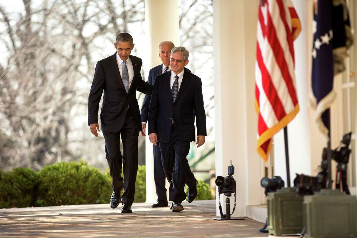 President Barack Obama walks to the Rose Garden with Merrick Garland, his nominee for the Supreme Court vacancy, to a news conference at the White House in Washington, March 16, 2016. Garland is currently chief judge for U.S. Court of Appeals D.C. Circuit. Behind is Vice President Joe Biden. (Doug Mills/The New York Times)