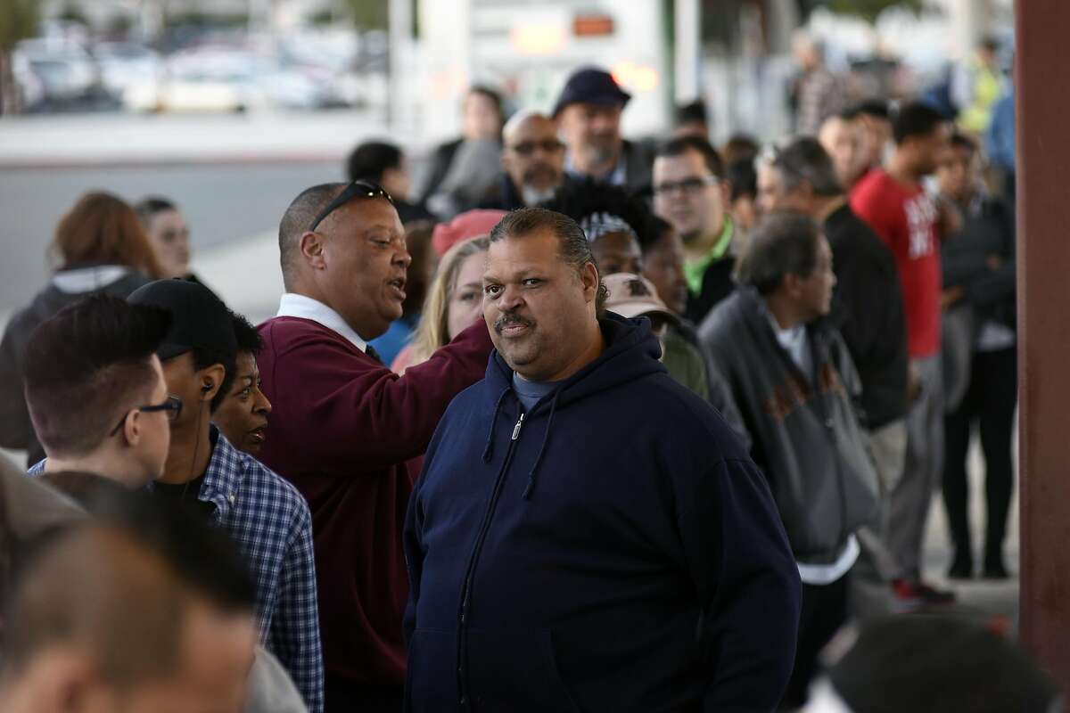 Customers line up to board free shuttle busses at the Pittsburg/Bay Point BART station in Pittsburg, CA Thursday, March 17, 2016. Free shuttle bus service was offered as BART service was out between the Pittsburg/Bay Point and Concord stations due to an electrical problem.