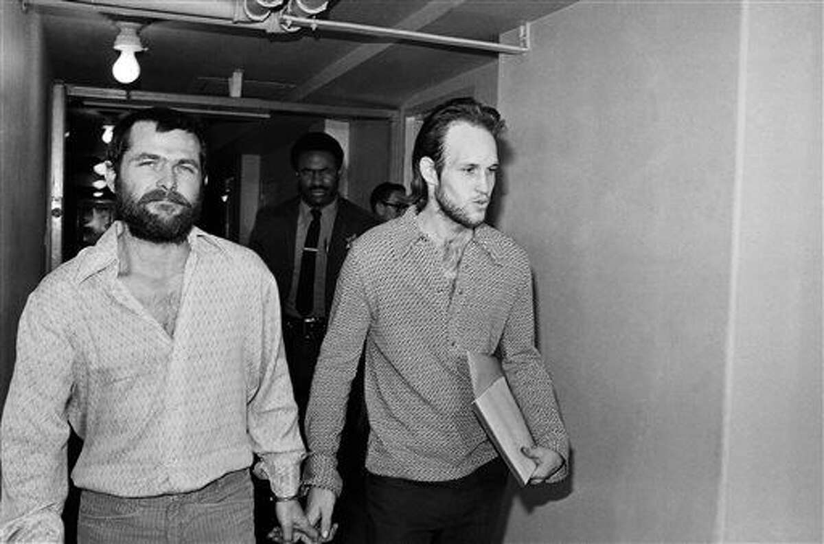 FILE - This Dec. 22, 1970 file photo shows Charles Manson followers Bruce Davis, left, and Steve Grogan leaving court after a hearing in Los Angeles. Gov. Jerry Brown has rejected parole for Davis a follower of cult leader Charles Manson 46 years after a series of bloody murders rocked Southern California, Friday, Jan. 22, 2016. Bruce Davis was convicted of the 1969 slayings of musician Gary Hinman and stuntman Donald "Shorty" Shea. He was not involved in the more notorious killings of actress Sharon Tate and six others.(AP Photo/Harold Filan, File)