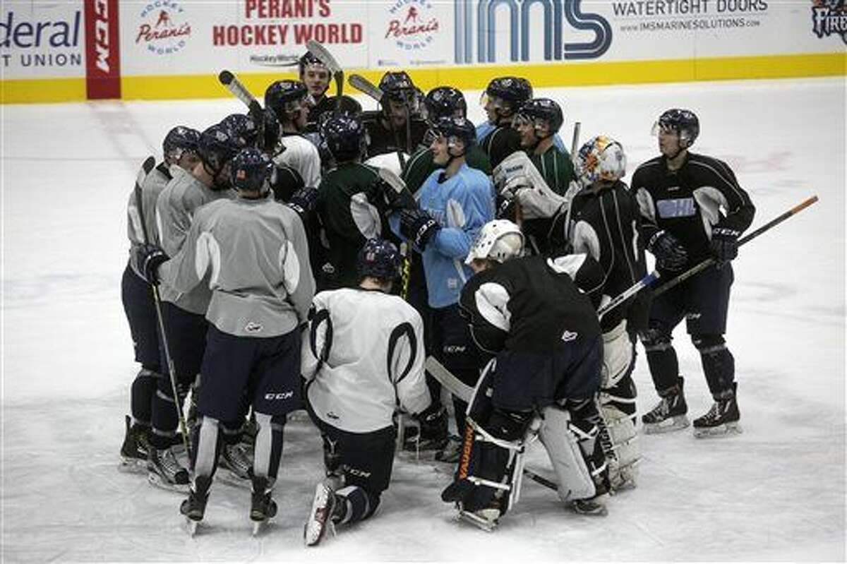 The Flint Firebirds gather up in a circle during the first day of practice on Wednesday after recommitting to the team following a brief all-team strike due the owner Rolf Nilsen's decision to fire the coaching staff on Sunday. Nilsen rehired the coaching staff on three-year contracts the within 24 hours of the initial firing.