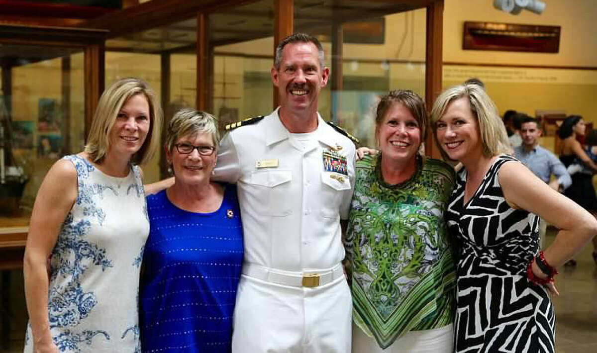 Attending the promotion of Steven Bailey to the rank of commander, as a Medical Service Corps-Healthcare Administrator, were from left, sister, Michelle Coberly; mother, Marsha Bailey; Steven Bailey; sister, Bridgett Petsnick; and sister Brenda Korejwo.