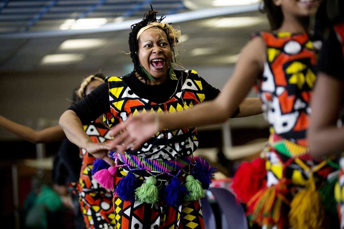 Jewellynne Richardson of Flint dances a traditional West African dance at Delta College on Thursday. Richardson dances with the Kuungana Drum and Dance Company.