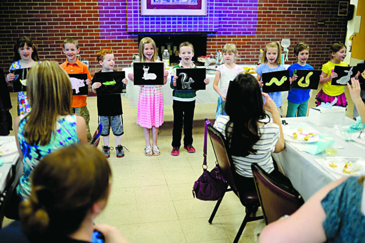 Kindergartners in Gail Kundinger's class at St. John's Lutheran School in Midland recite a poem for their mothers during a brunch held in their honor on Friday.
