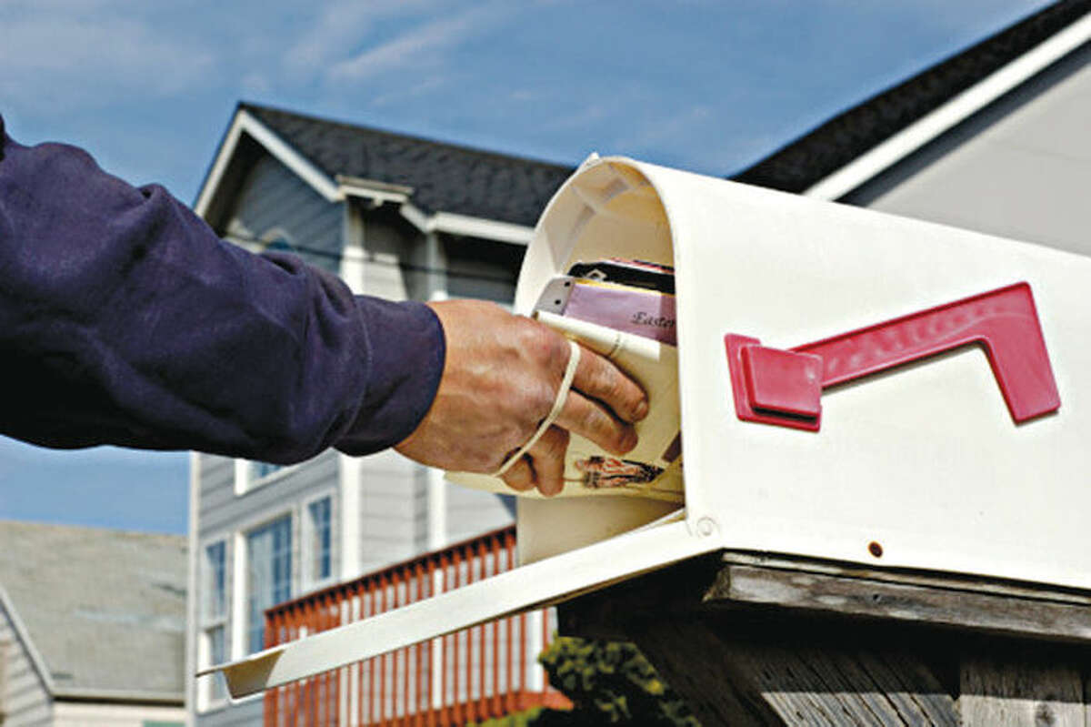 Contact the post office and have them hold your mail or ask a trusted neighbor to collect mail.