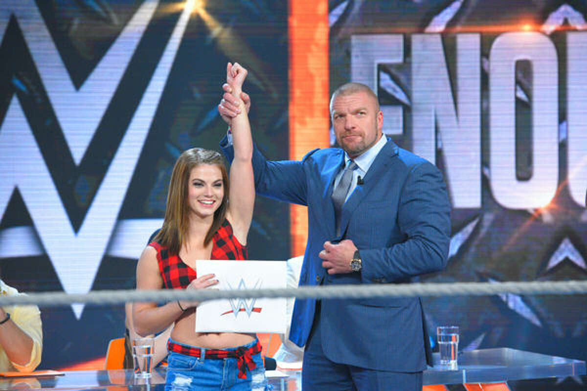 Hope's Sara Lee with WWE Executive Vice President Triple H.