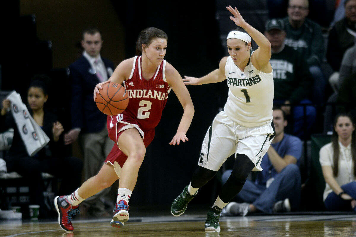 FILE — Indiana's Jess Walter, left, moves past Michigan State's Tori Jankoska during the first half on Wednesday at the Breslin Center in East Lansing. Michigan State won 72-57.