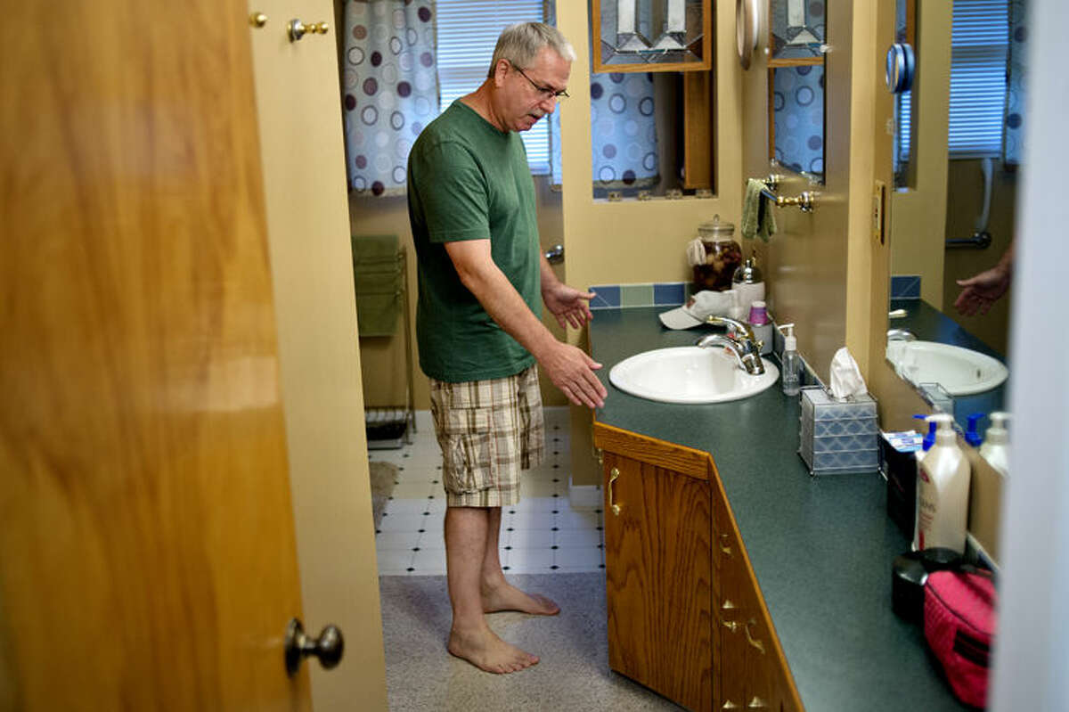 Kevin Church talks about renovations needed to his bathroom on Monday in Midland. Kevin and his wife Tammie set up a GoFundMe site to help raise money to make their bathroom accessible for Tammie who has Parkinson's disease. They need larger door put in to make it more accessible for Tammie's walker, among other improvements.