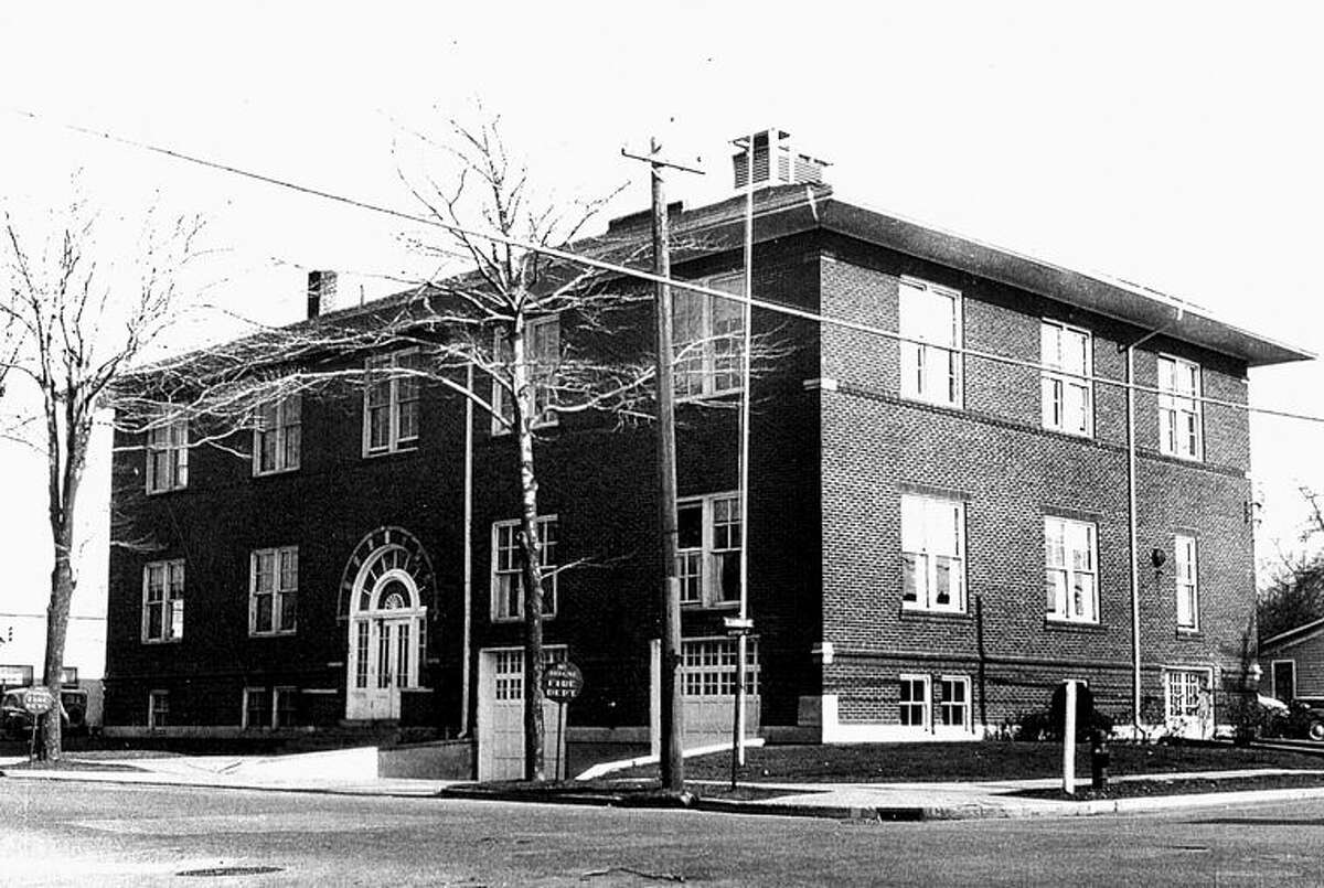 This is the Knights of Pythias Temple shortly after it was remodeled into the new City Hall for Midland located on Ashman Street, then a two-way street. Sold to the City of Midland for one dollar, the “temple” was remodeled by two young men, Karl B. Robertson who worked for the City of Midland and Ralph Boone who worked for The Dow Chemical Co. but was loaned by Dr. Dow to assist Robertson in the formidable job of renovation. The first desks in the Council Chambers were made from plywood with linoleum on top. One of the first items of business when the new City Council met was to appropriate $900 for new desks.