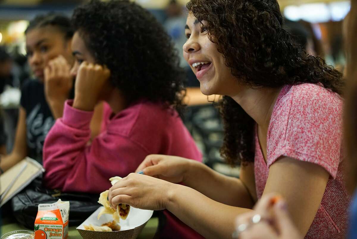 Junior Javonne Douglas laughs with her friends at Monterey High School in Monterey, Calif. on Tuesday, Aug. 25, 2015. Oakland Unified and Berkeley will be joining Bay2Tray which will send them underutilized fish such as Grenadier to use in their lunch programs.
