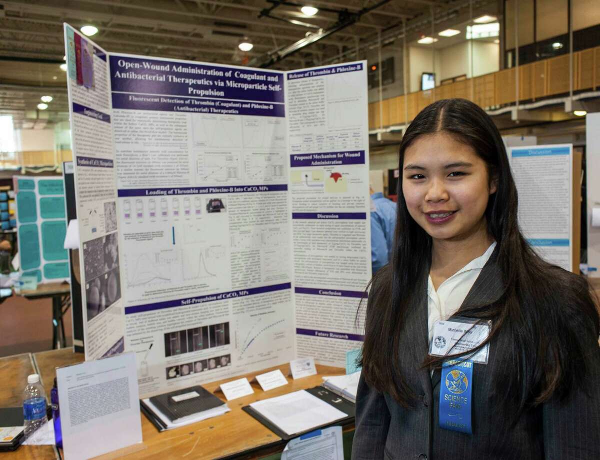 Michelle Woo from Greenwich High School with her entry at the Connecticut Science & Engineering Fair held at Quinnipiac University, Hamden, CT Thursday, March 17, 2016.