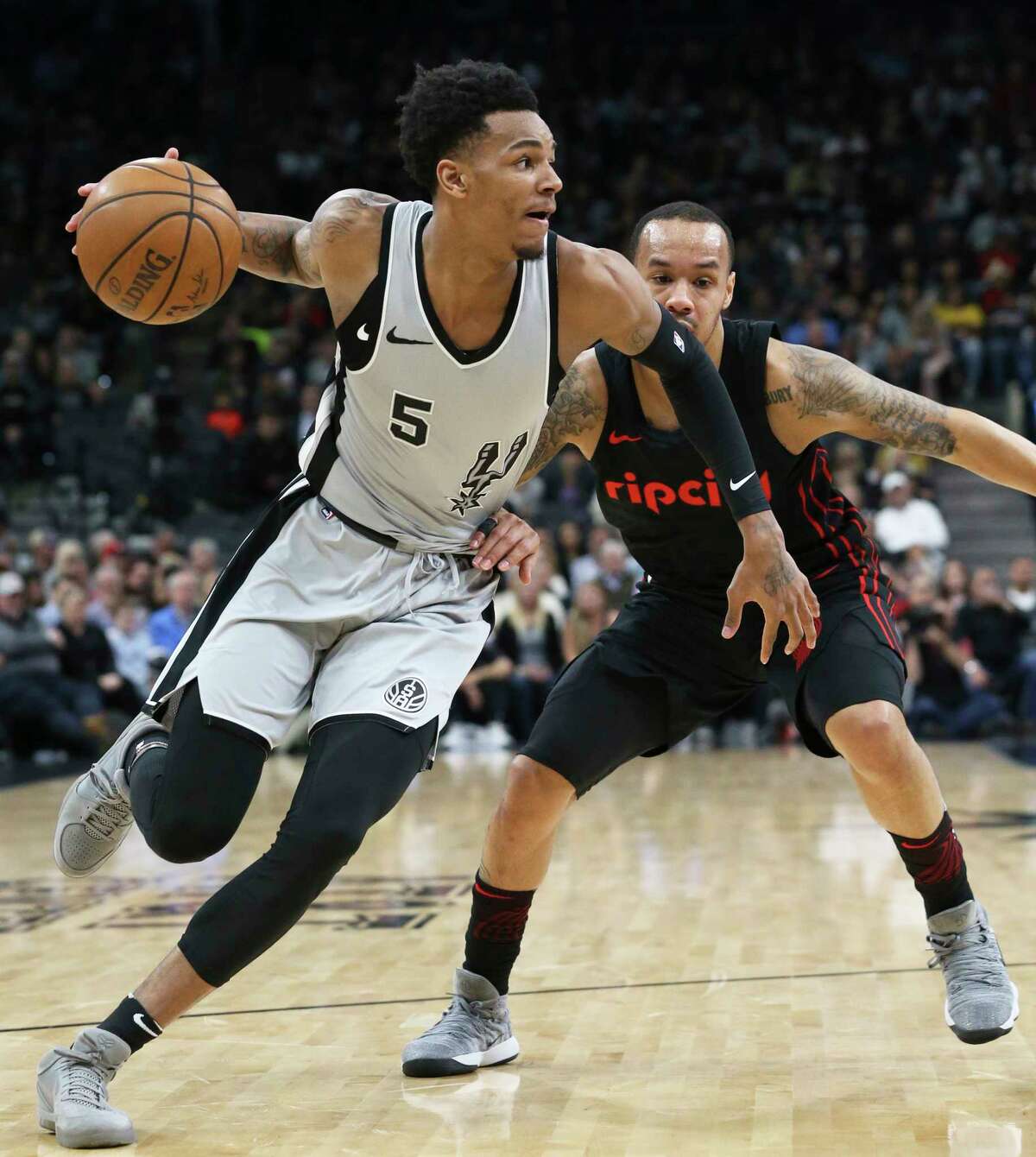 Dejounte Murray turns the corner into the lane as the Spurs play the Portland Trailblazers at the AT&T Center on April 7, 2018.