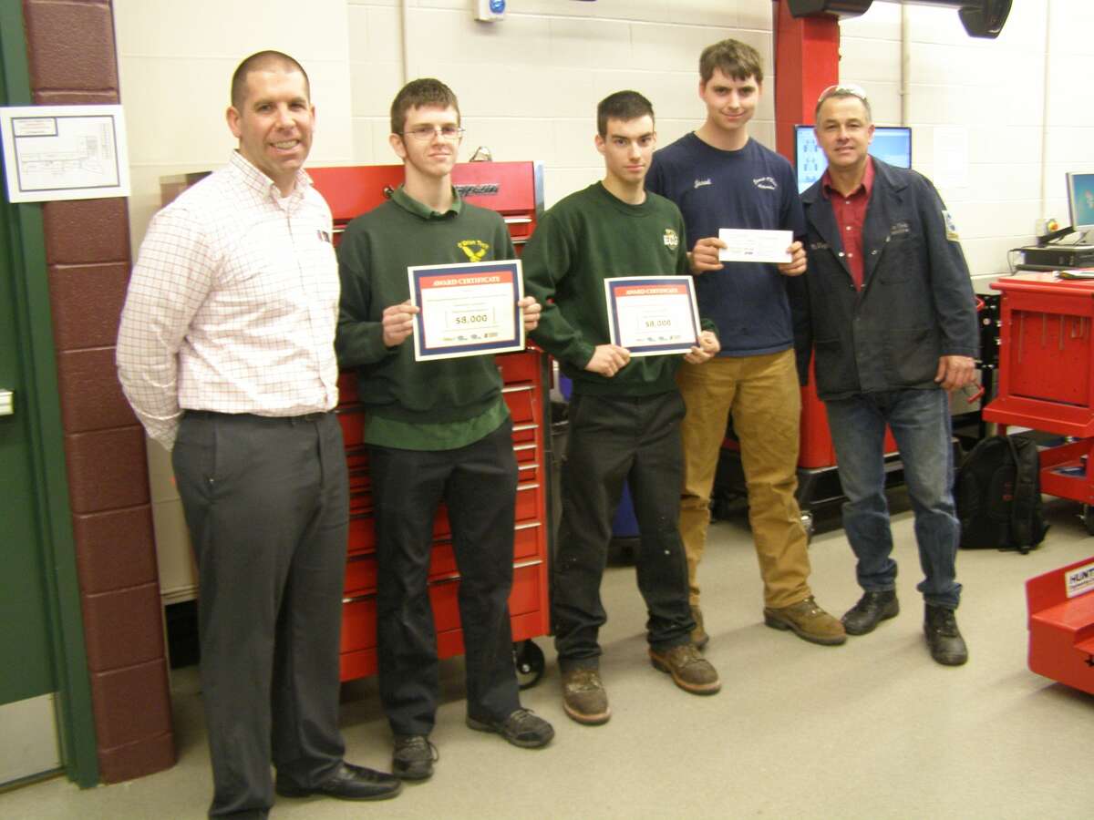 Emmett O’Brien students receive a $1,500 tool voucher for the school and over $30,000 in scholarship awards from Universal Technical Institute (UTI) for winning second place at the Connecticut Automotive Retailers Association Automotive Technology Challenge and the Top Tech Challenge auto skills competition. From left to right are UTI representative Michael Balthazrr, students Jesse Cavallaro-Dahn, Jeffrey Berger and Jared Saunderson, and Emmett O’Brien instructor Ignacio Vega.
