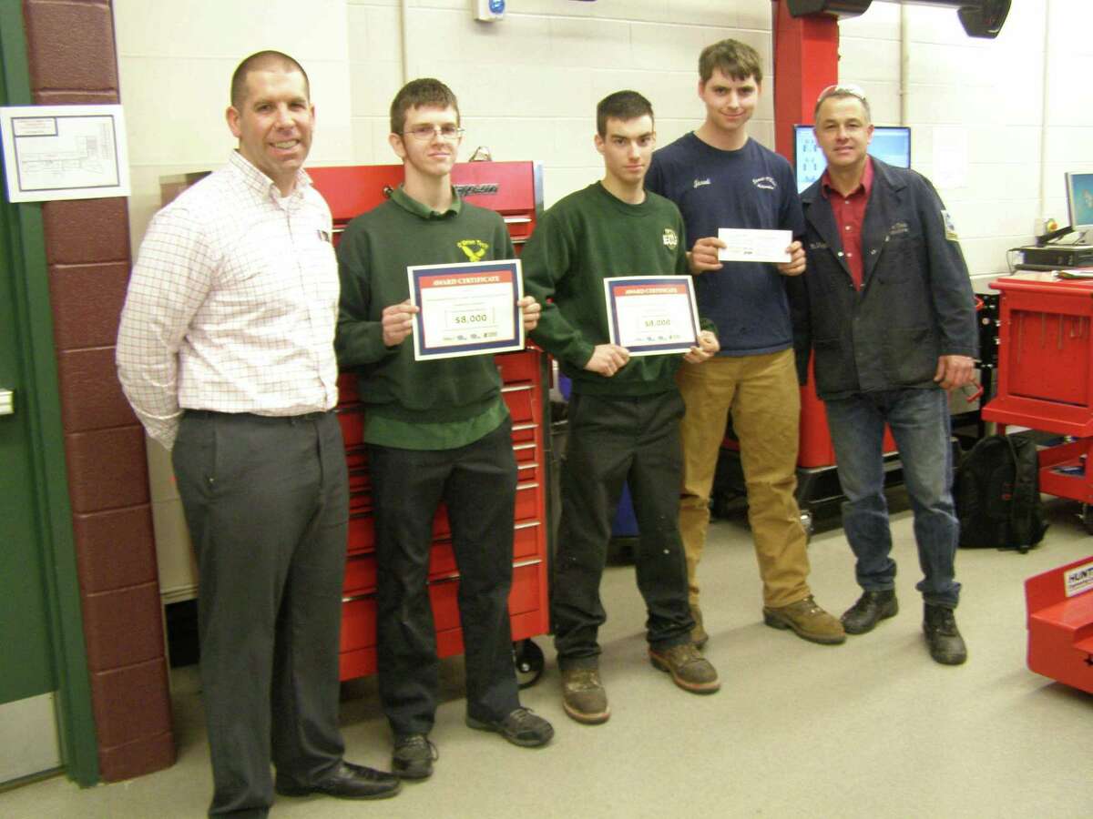 Emmett O’Brien students receive a $1,500 tool voucher for the school and over $30,000 in scholarship awards from Universal Technical Institute. From left to right are UTI representative Michael Balthazrr, students Jesse Cavallaro-Dahn, Jeffrey Berger and Jared Saunderson, and Emmett O’Brien instructor Ignacio Vega.