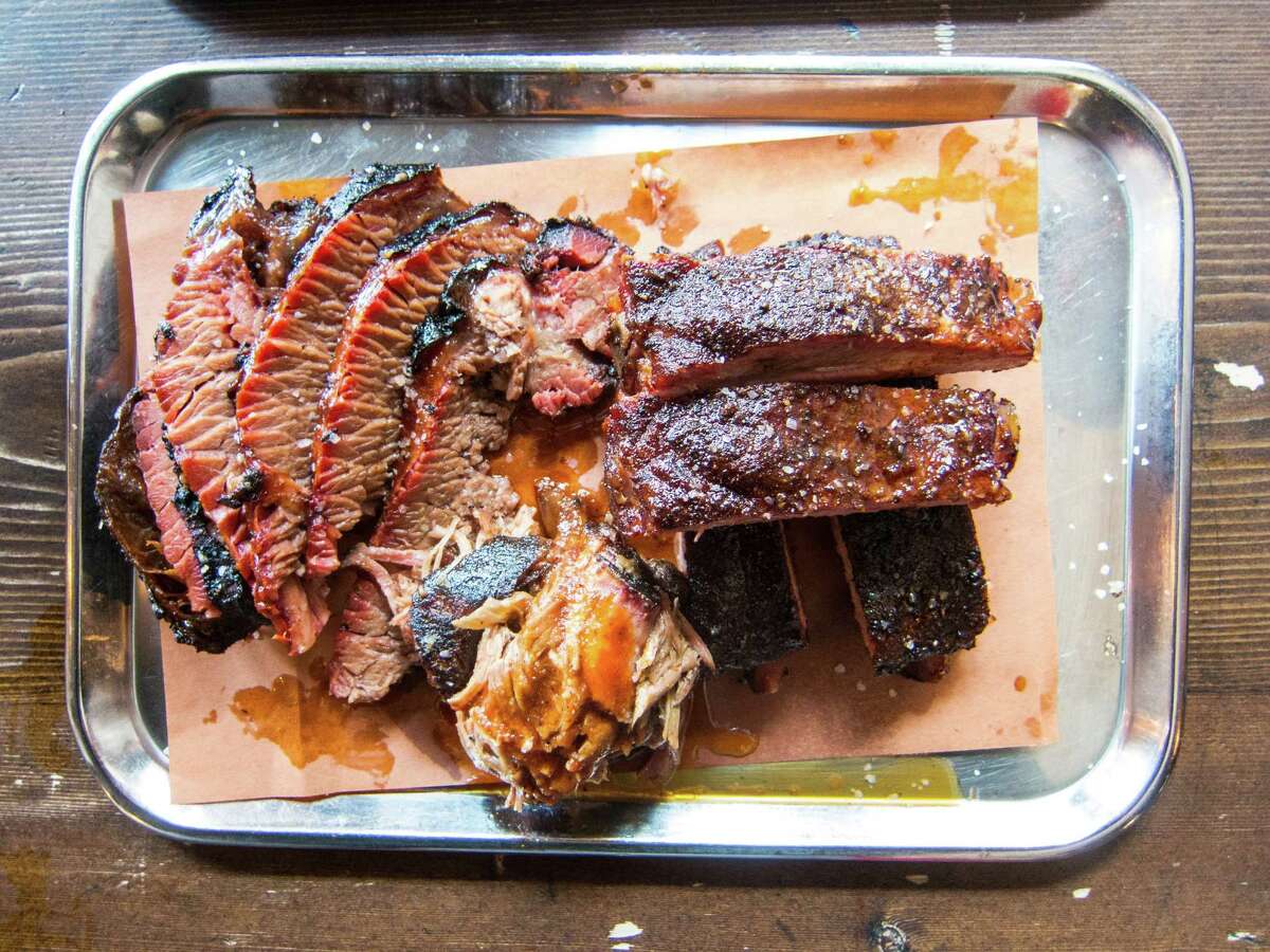 Meat plate with brisket, pork ribs, pulled pork at Mighty Quinn's Barbeque - East Village in New York City