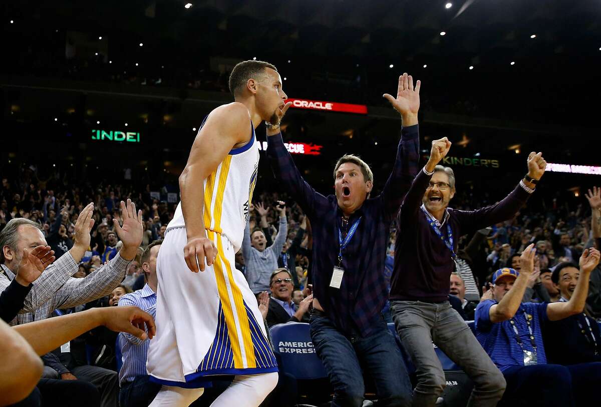 OAKLAND, CA - MARCH 14: Fans react after Golden State Warriors made a three-point basket against the New Orleans Pelicans at ORACLE Arena on March 14, 2016 in Oakland, California. NOTE TO USER: User expressly acknowledges and agrees that, by downloading and or using this photograph, User is consenting to the terms and conditions of the Getty Images License Agreement. (Photo by Ezra Shaw/Getty Images)