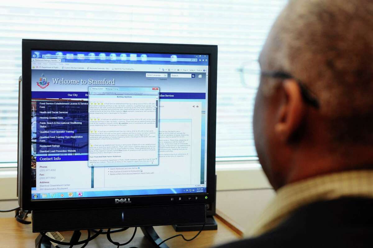 Ron Miller, Director of Environmental Inspections for the City of Stamford, scrolls through the city's restaurant reviews website in his office on Wednesday, Feb. 24, 2016.