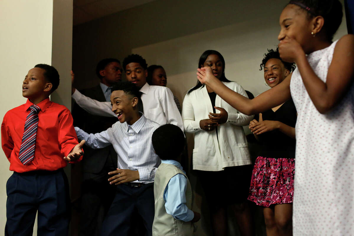 Ray Hardie, 11, from left, Jaden White, 13, Charles Daniels, 17, Ebreyiah McCaskill, 17, Amirah Perry, 13, and Jerzi White, 10, wait their turn to walk on stage for the SUIT UP! fashion show during the 2016 Inaugural Teen Summit at Second Baptist Church Community Center in San Antonio on Friday. SUIT UP! Business and Professional Clothing Exchange Program is a "community initiative to collect new/ gently worn professional attire for teens/adults entering or re-entering the workforce" created by Walter Perry, also a Teen Summit organizer.