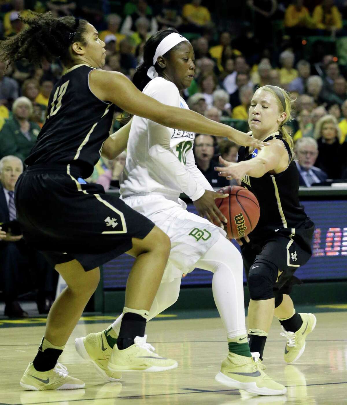Baylor's Alexis Jones fights off being double-teamed by Idaho's Ali Forde, left, and Karlee Wilson, right, to lead the top-seeded Lady Bears with 23 points.