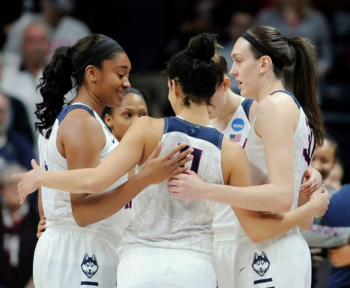 Connecticut players huddle together during a first round women's college basketball game against Robert Morris in the NCAA Tournament, Saturday, March 19, 2016, in Storrs, Conn.