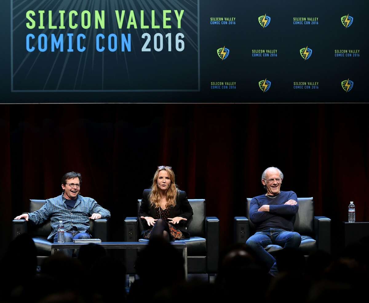 Michael J. Fox (L), Lea Thompson (C) and Christopher Lloyd (R) take part in a panel discussion on "Back to the Future" during te Silicon Valley Comic Con in San Jose, California on March 19, 2016. The comic and entertainment-themed event features exhibits, panel discussions and pop culture artistry. Fox, Lloyd and Thompson starred the 1985 US science-fiction adventure comedy film "Back to the Future." / AFP PHOTO / JOSH EDELSONJOSH EDELSON/AFP/Getty Images