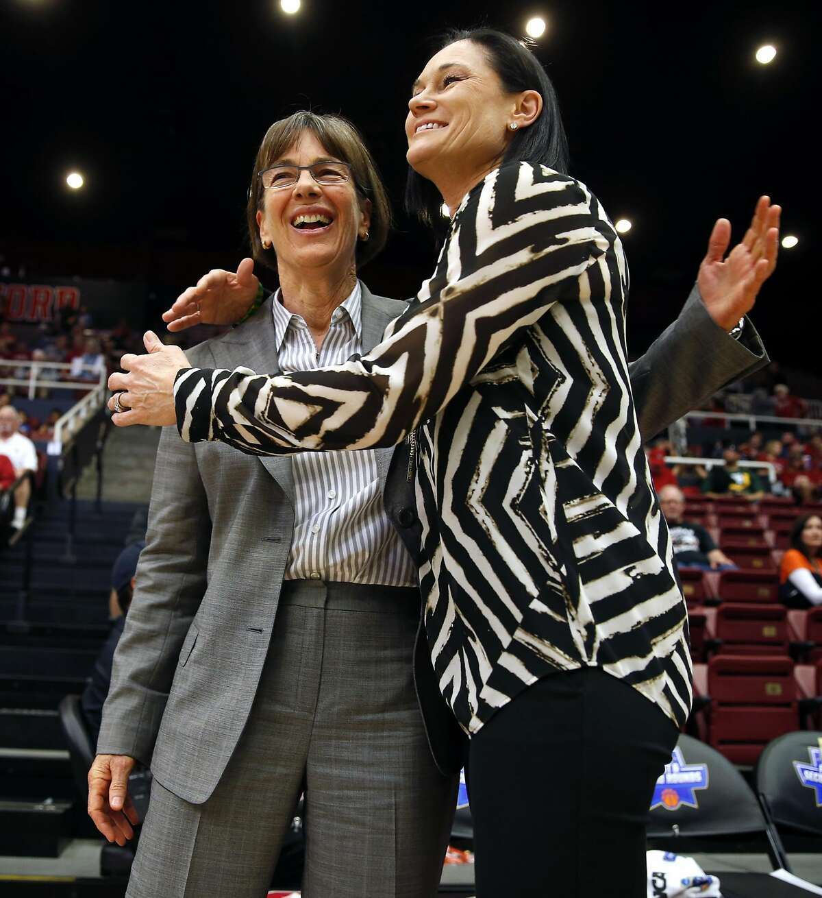 Stanford head coach Tara VanDerveer (left) and San Francisco head coach Jennifer Azzi embrace before their team's faced off during 2016 NCAA Division 1 Women's Basketball Tournament game at Maples Pavilion in Stanford, Calif., on Saturday, March 19, 2016.